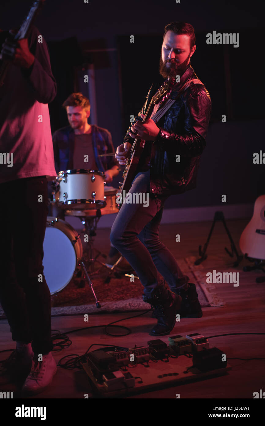 Band performing in recording studio Stock Photo Alamy