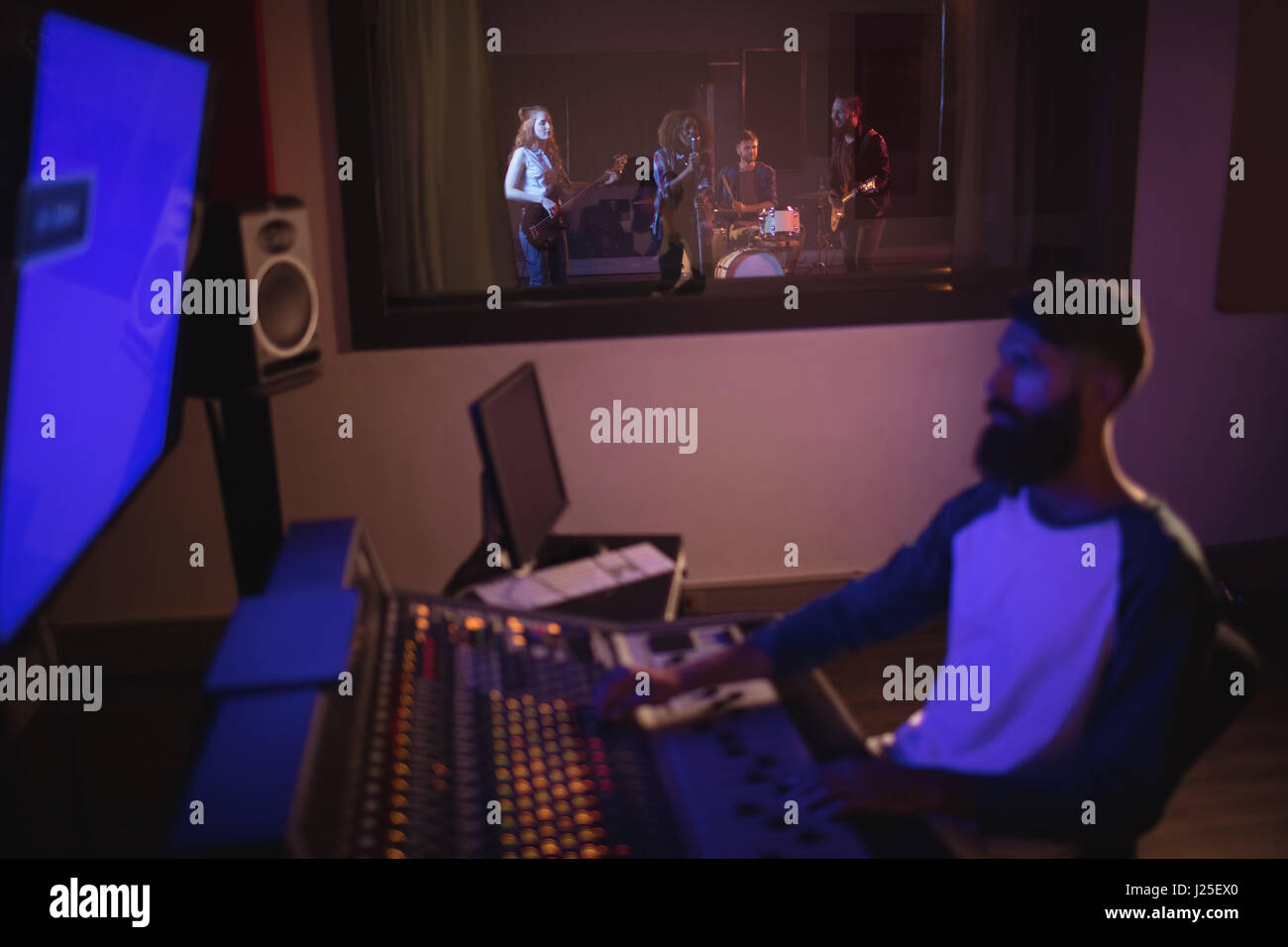 Music composer recording music in the studio Stock Photo