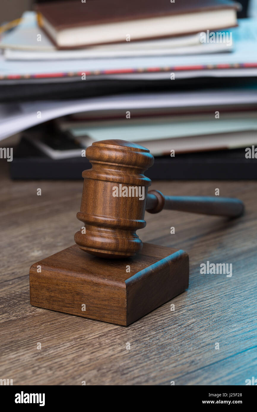 Hammer of judge against folder Stock Photo