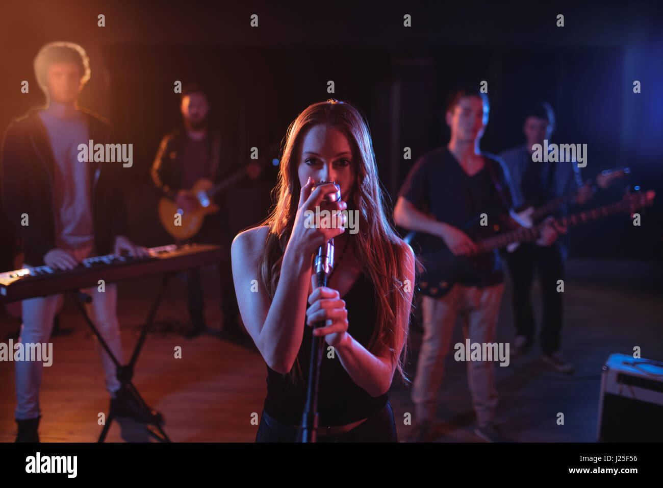 Band performing in recording studio Stock Photo Alamy