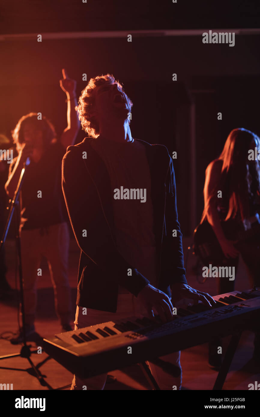 Musician playing electronic piano in recording studio Stock Photo Alamy