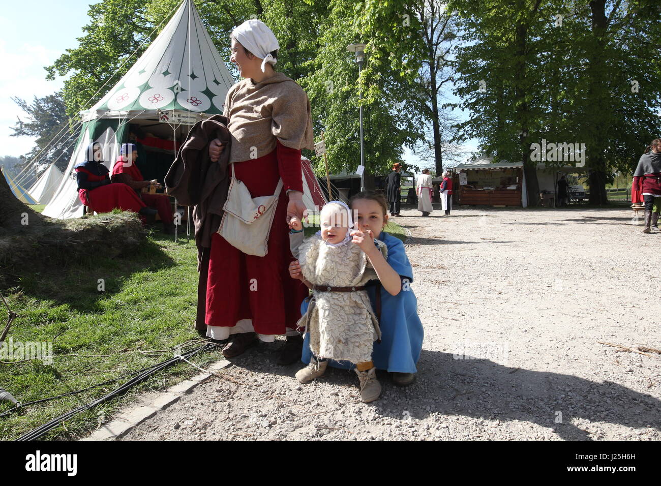 People in costume and items for sale at a medieval fair Stock Photo - Alamy