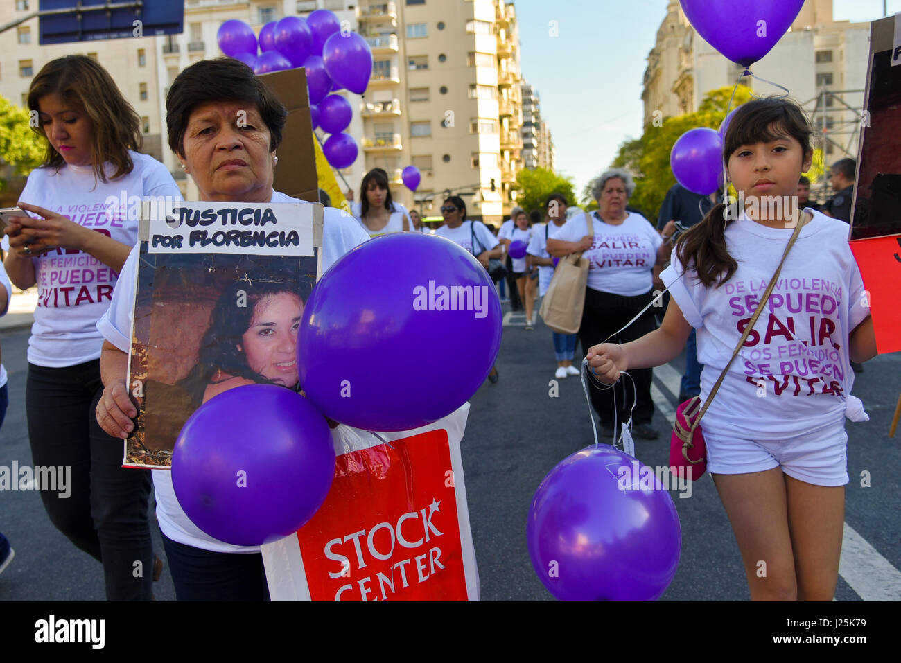 Thousands of women wave banners as they protest violence against women on International Day for the Elimination of Violence against Women in Buenos Aires on November 25, 2016. Stock Photo
