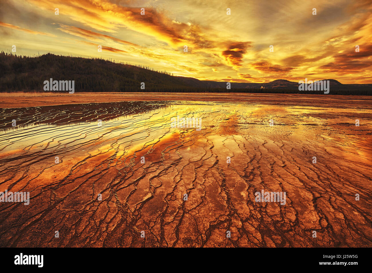 Dramatic sunset at Grand Prismatic Spring in Yellowstone National Park, Wyoming, USA. Stock Photo