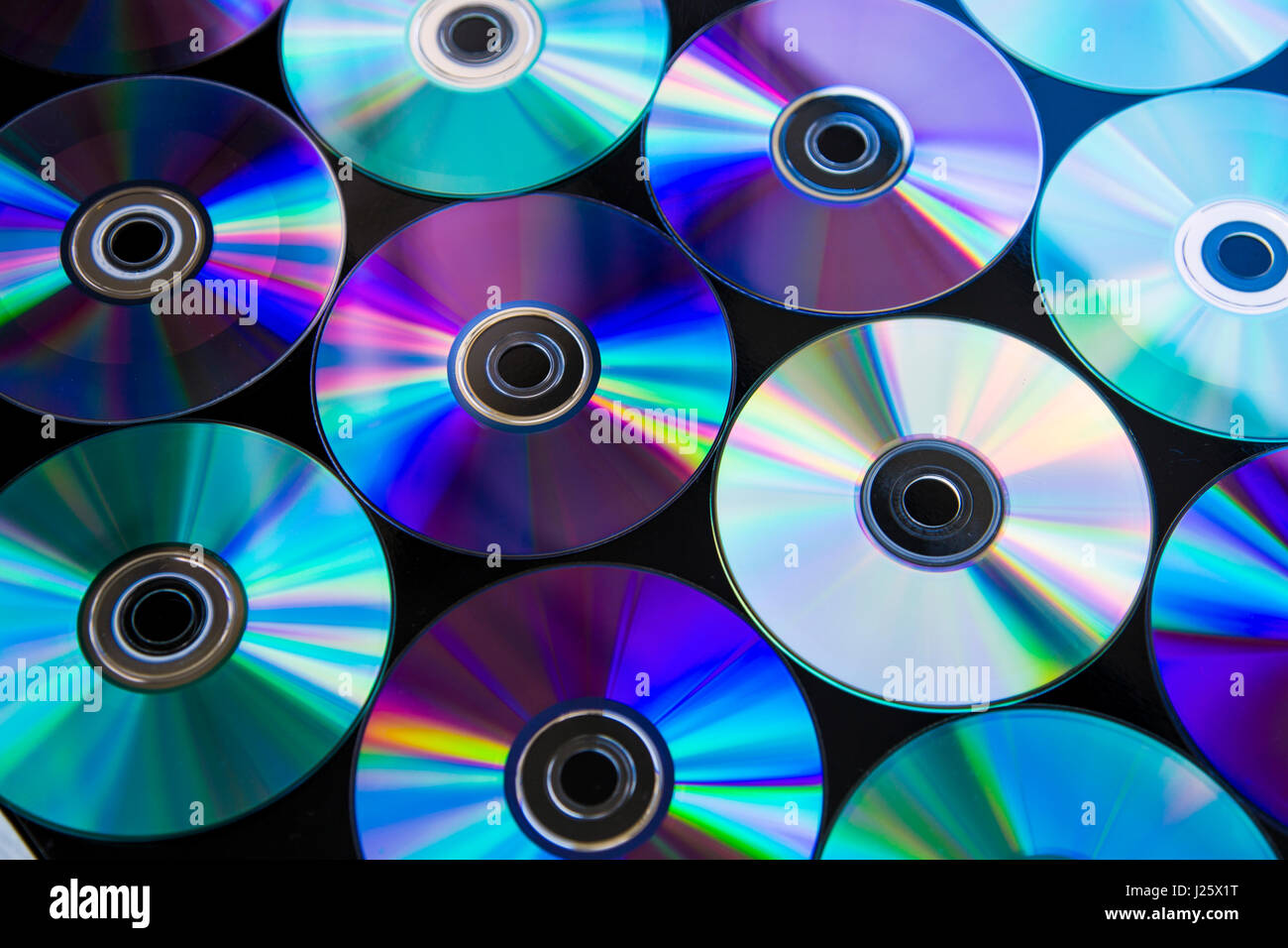 CDs / DVDs arranged in rows background Stock Photo