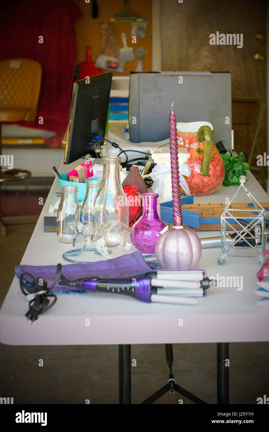 A Table Full Of Marked Down Merchandise For Sale Inside At A