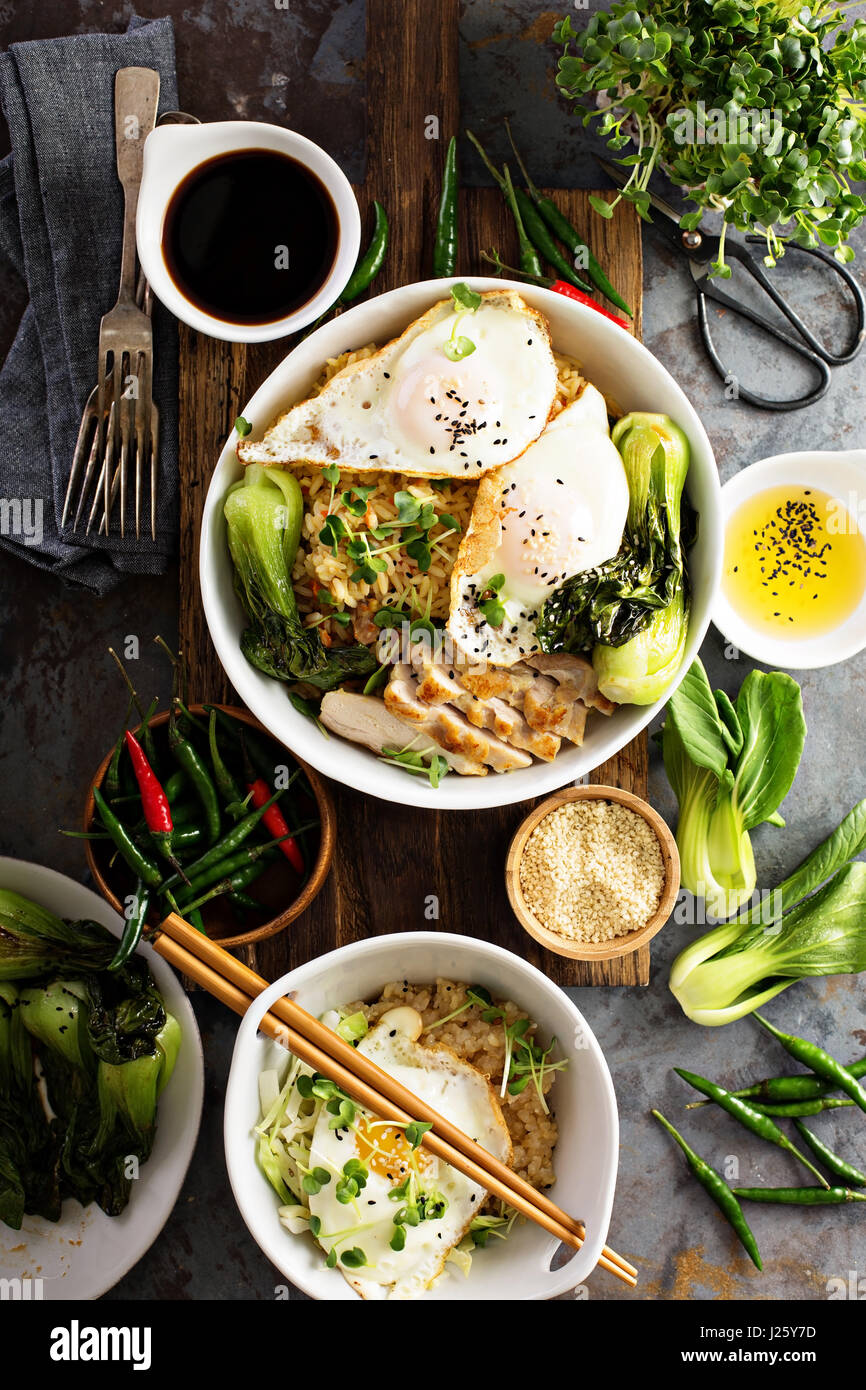 Asian food concept with fried rice, baby bok choy, eggs and soy sauce Stock Photo Alamy