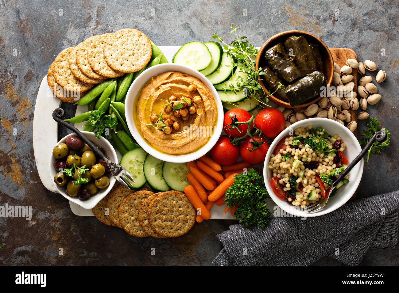 Hummus and fresh vegetables snack platter with grain salad and crackers Stock Photo Alamy