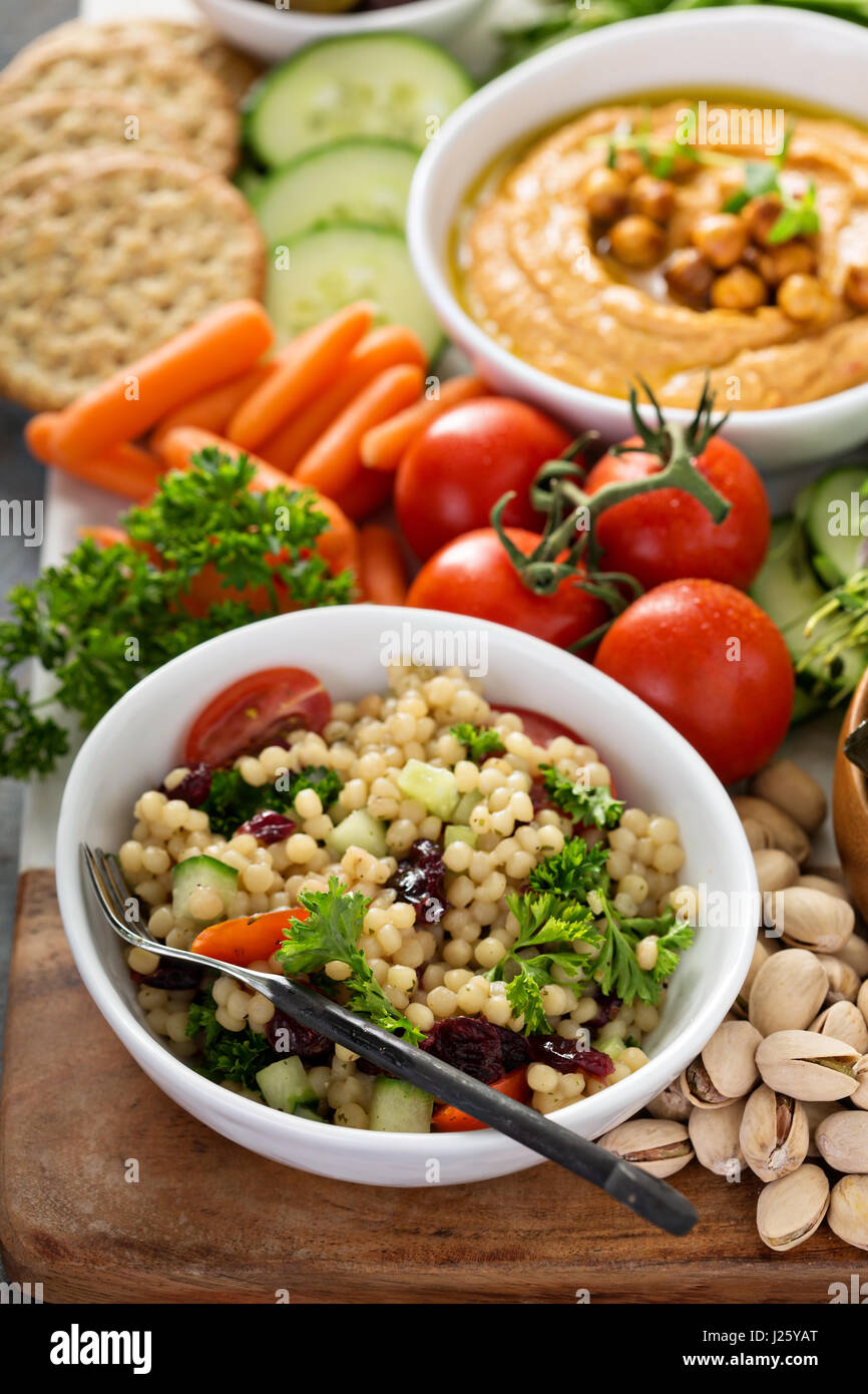Pearl couscous salad with fresh vegetables and herbs Stock Photo Alamy