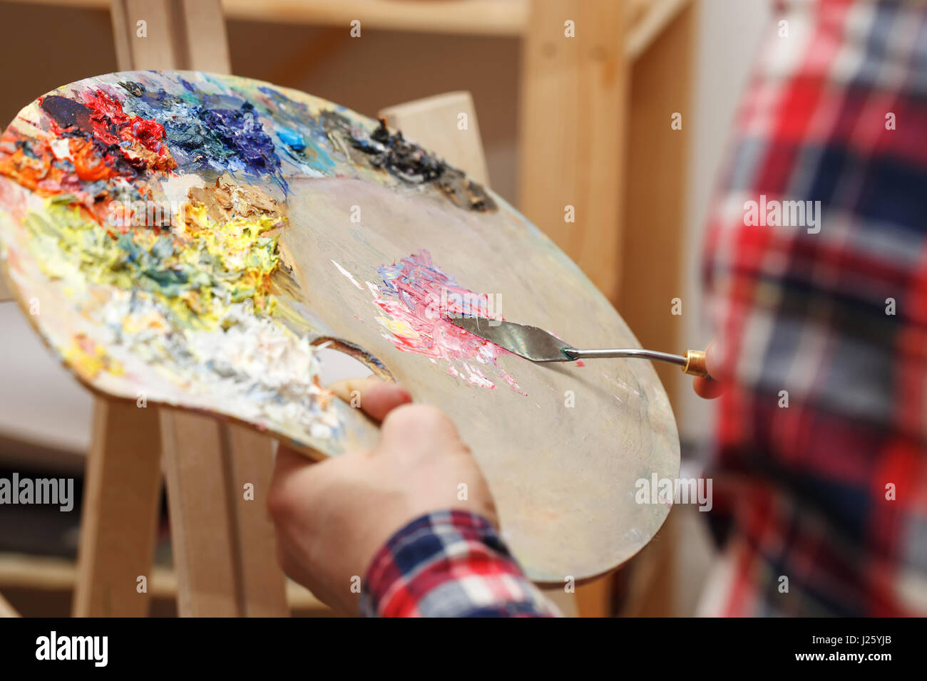 Man mixes oil paints hi-res stock photography and images - Alamy