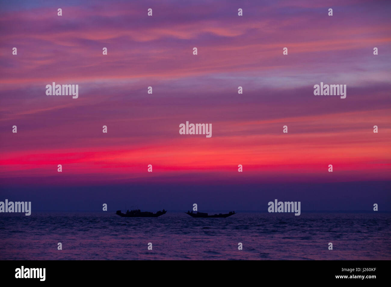 Fishing boats on the Bay of Bengal at Dublarchar in the Eastern Division of Sundarbans forest. Bagerhat, Bangladesh. Stock Photo