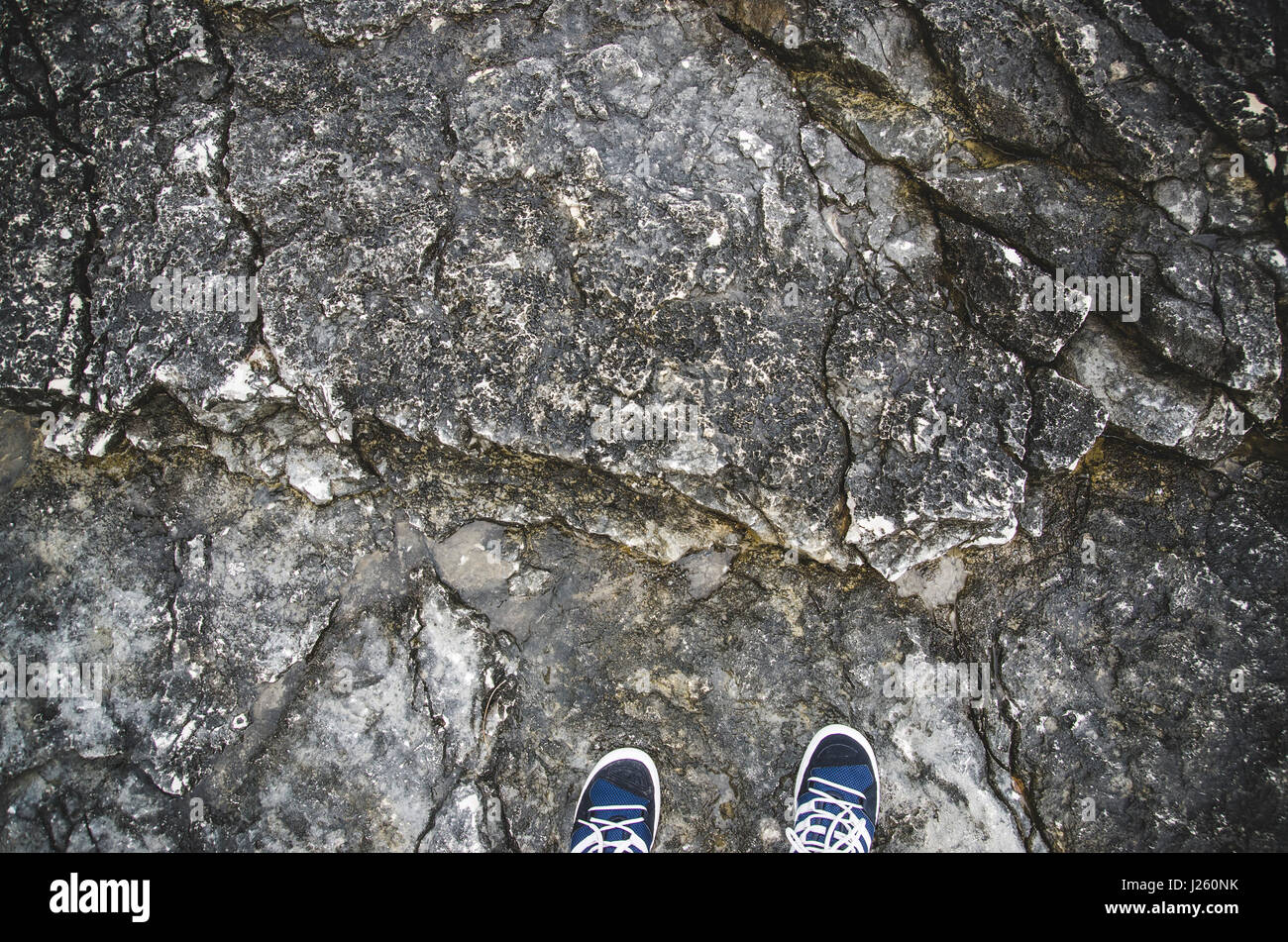 View of Feet on Rocks, Kamenjak National Park, Premantura, Croatia Stock Photo