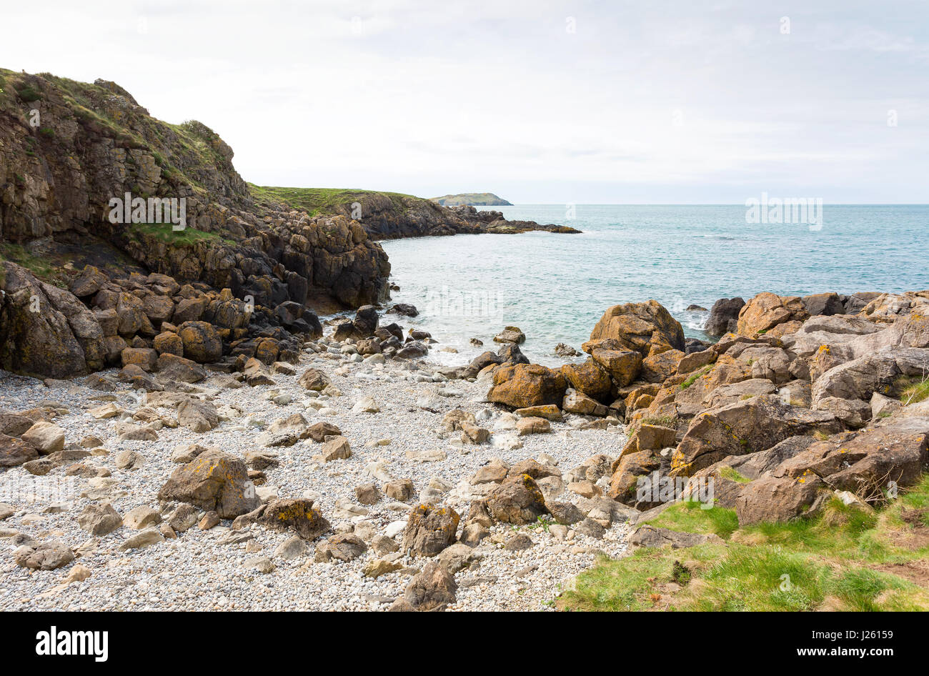 Rocky bay close to Cemaes Bay in Anglesey, North Wales Stock Photo