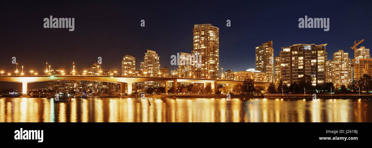 Vancouver city skyline at night view with buildings and bridge. Stock Photo