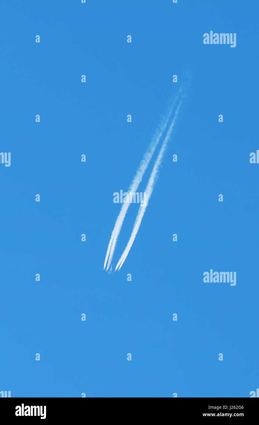 Airplane flying in the sky Stock Photo - Alamy