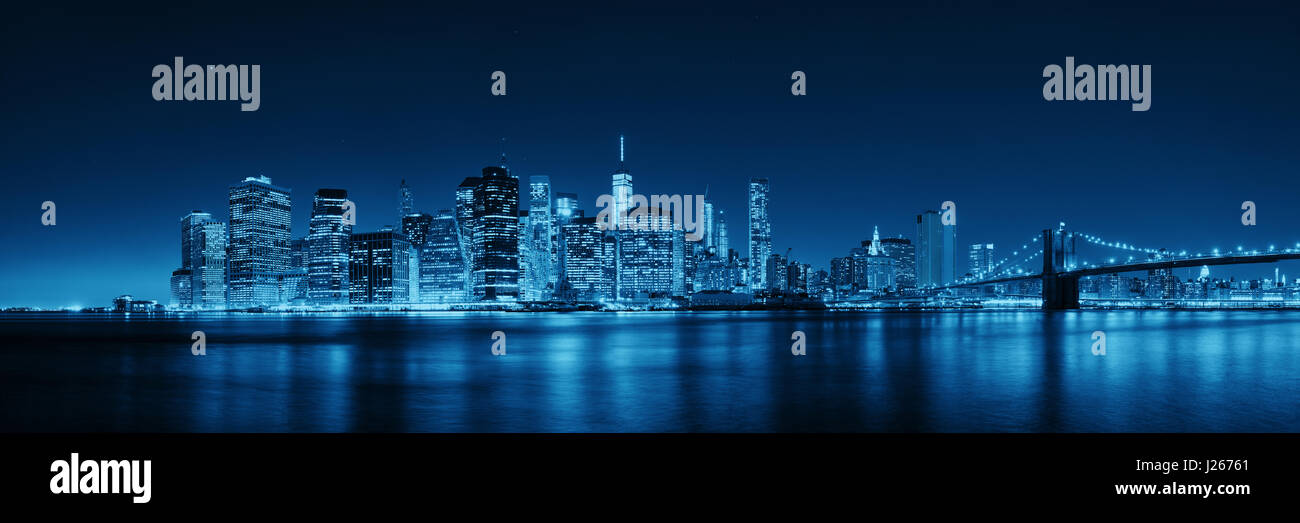 Downtown Manhattan skyline over East River at night in New York City ...