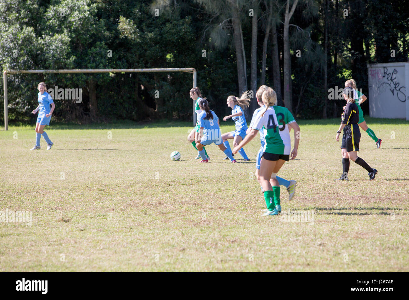 Ladies womens amateur football soccer game in Australia, part of the Manly Warringah football league of games, with referee Stock Photo