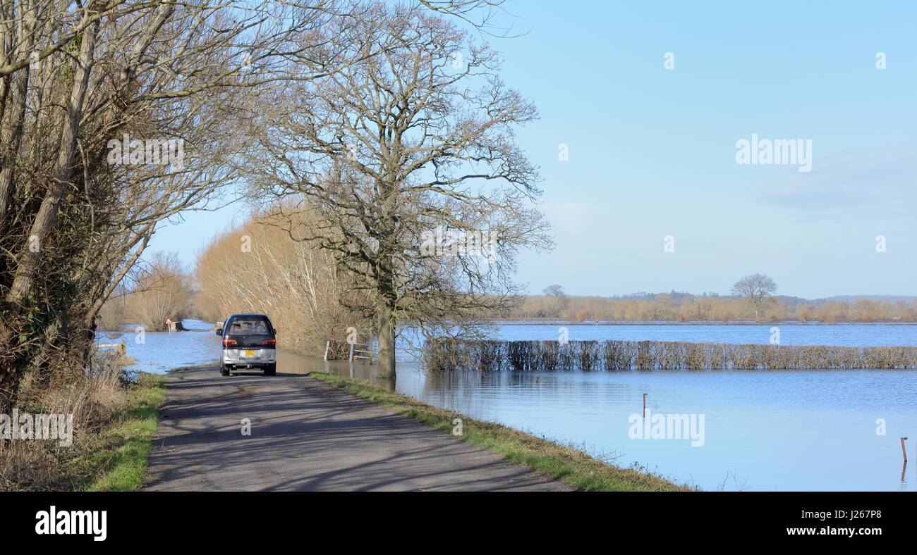 Severely flooded A361 between East Lyng and Burrowbridge across Lower Salt  Moor after weeks of heavy rain, impassable for vehicles, Somerset Levels. Stock Photo