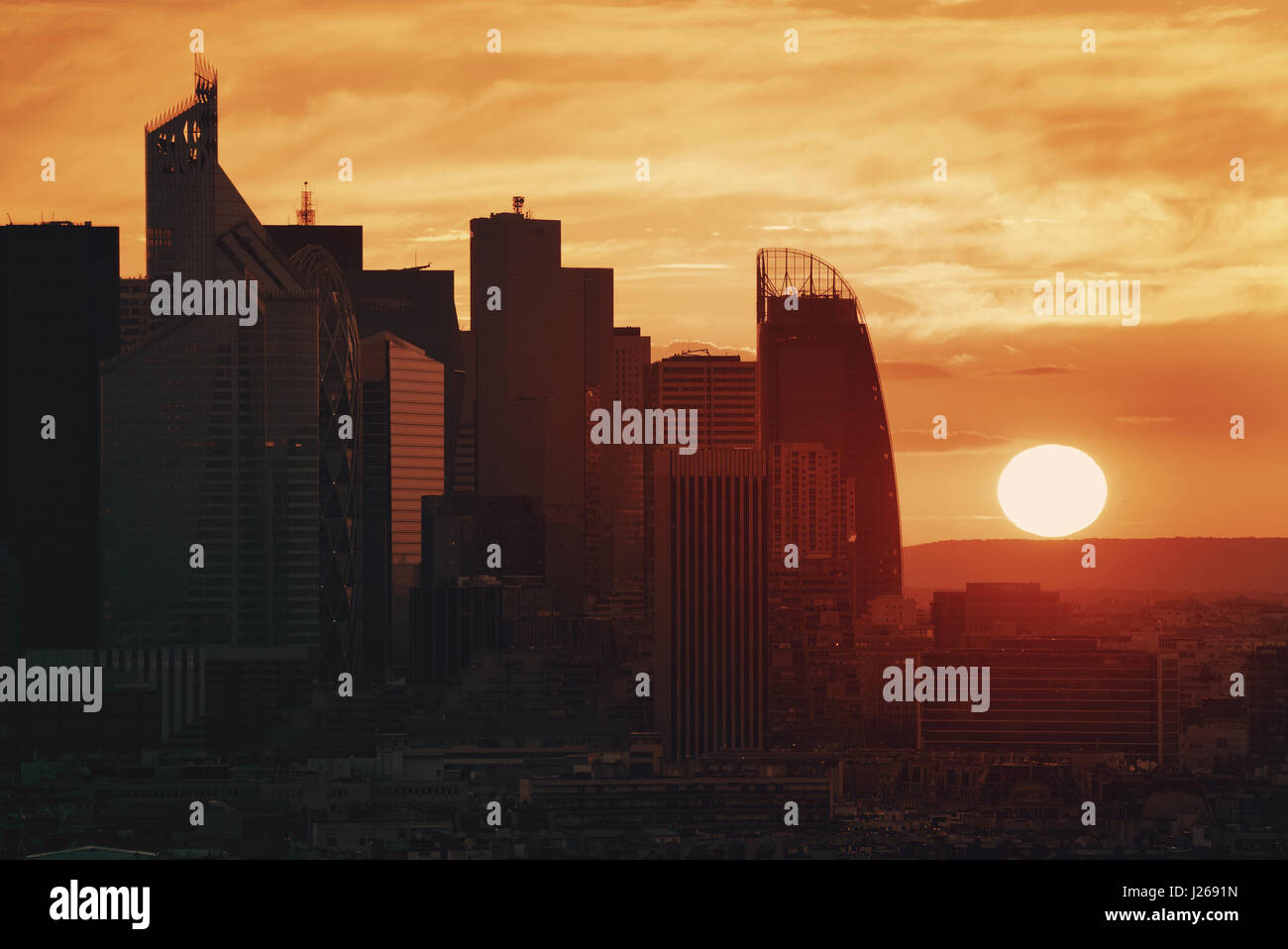 Paris sunset rooftop sunset view of the city skyline with la Defense business district in France