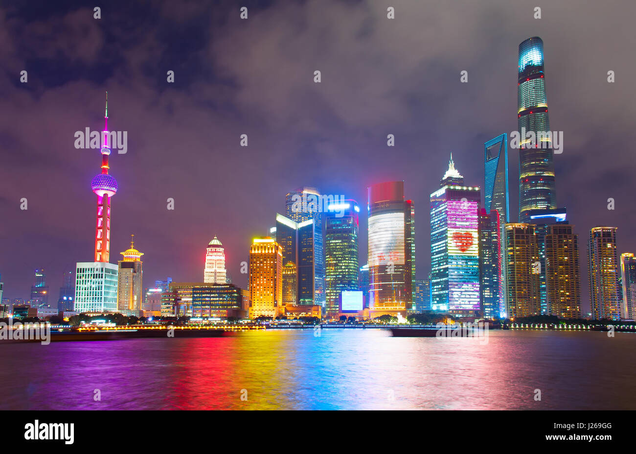 Skyline of Shanghai Downtown at night with reflection in the river Stock Photo