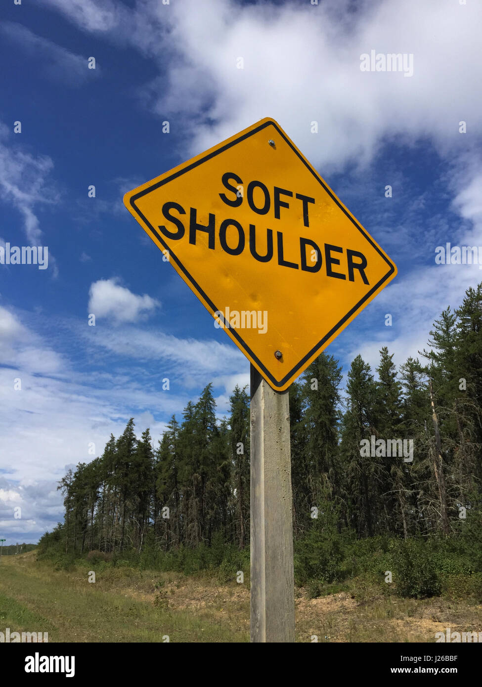 Soft Shoulder Sign on a Rural Road. Stock Photo