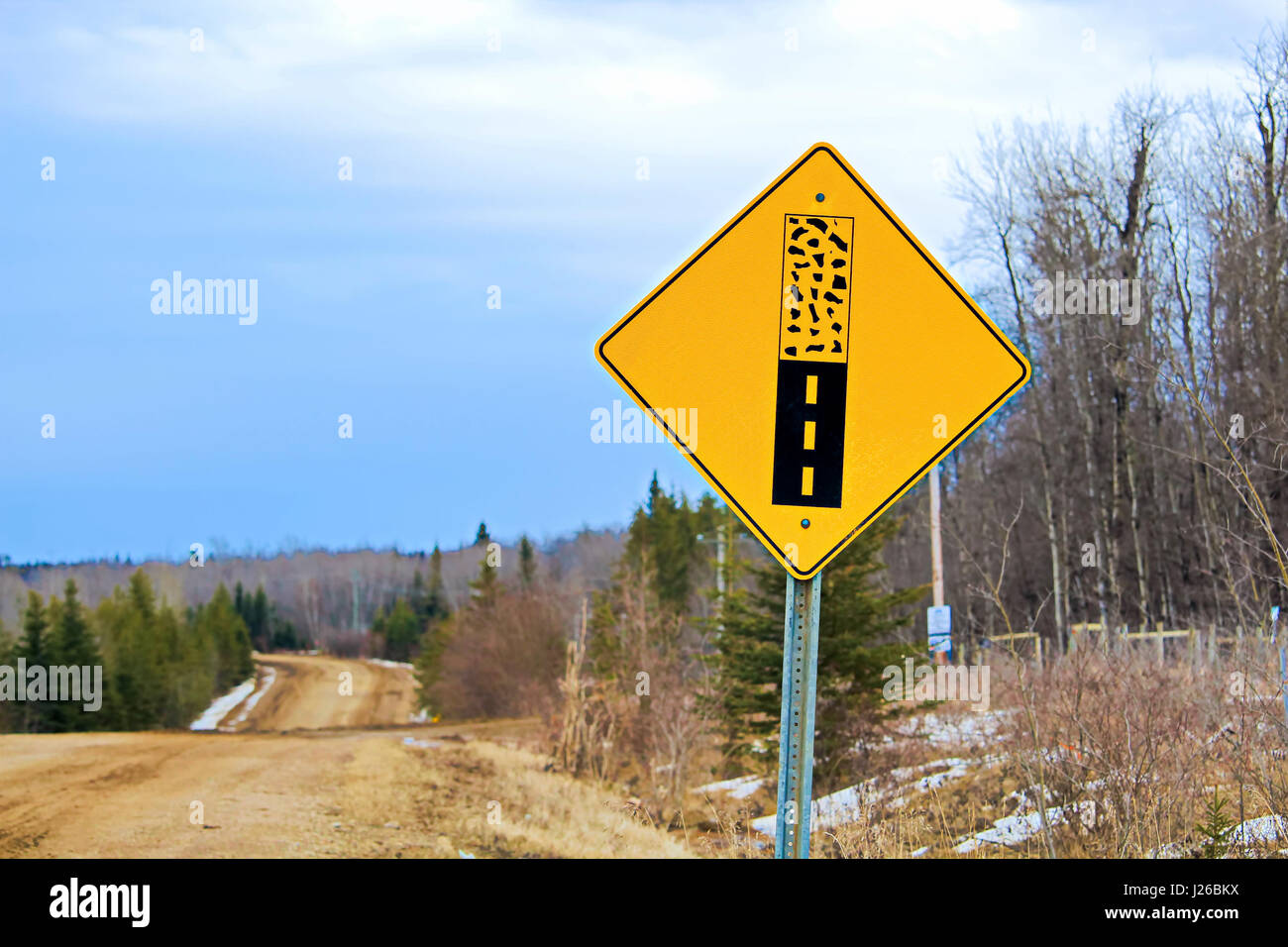 Pavement ends warning sign on a back road. Stock Photo