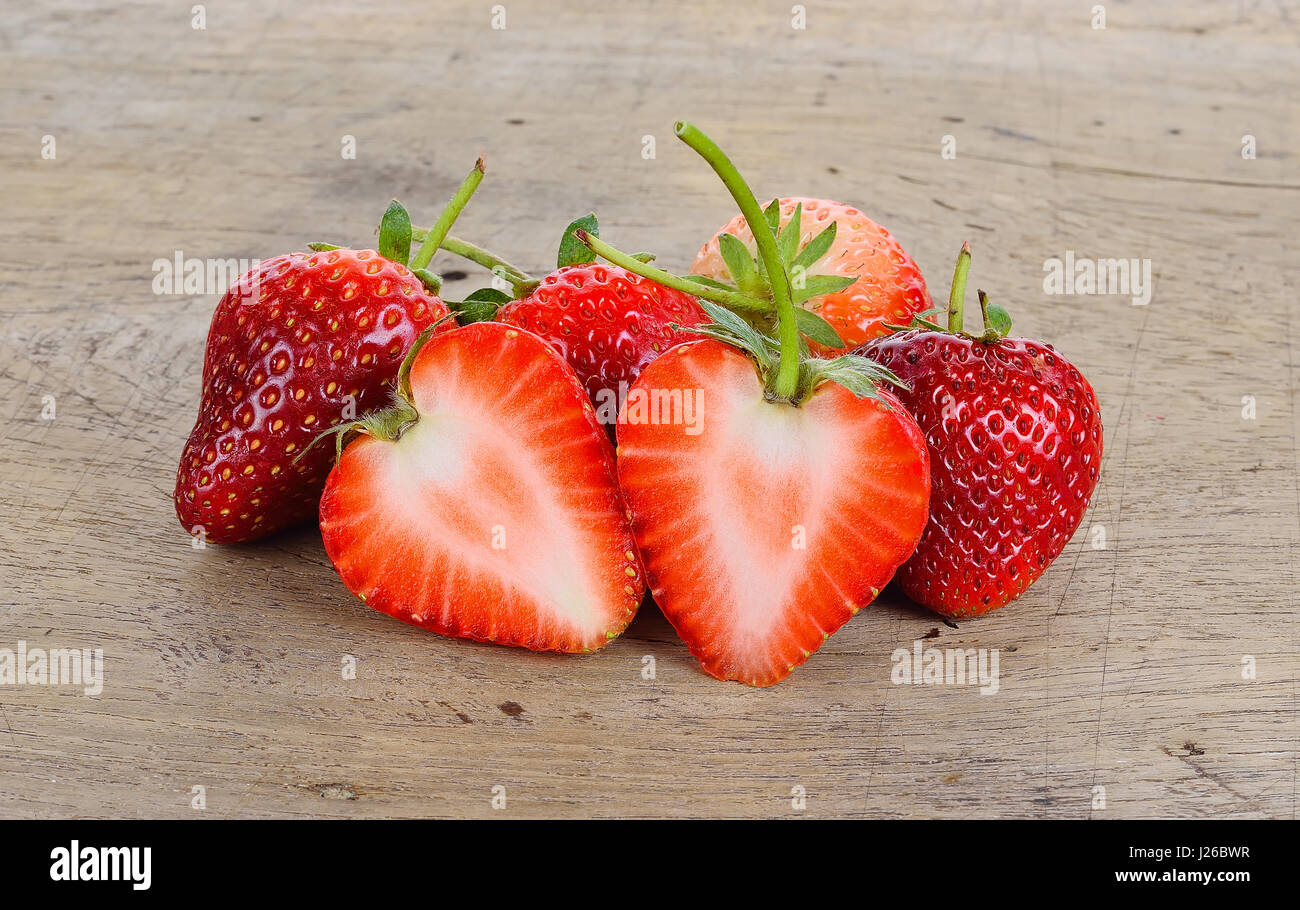 The strawberries on the wood background Stock Photo - Alamy