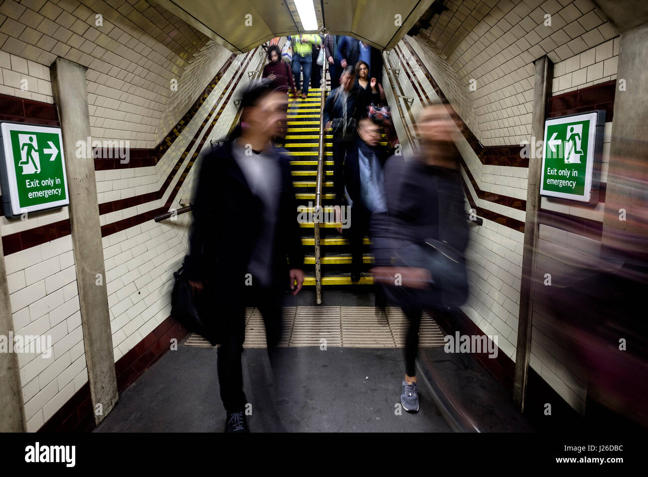 People walking fast during rush hour at an underground metro station in London, England, UK, Europe Stock Photo