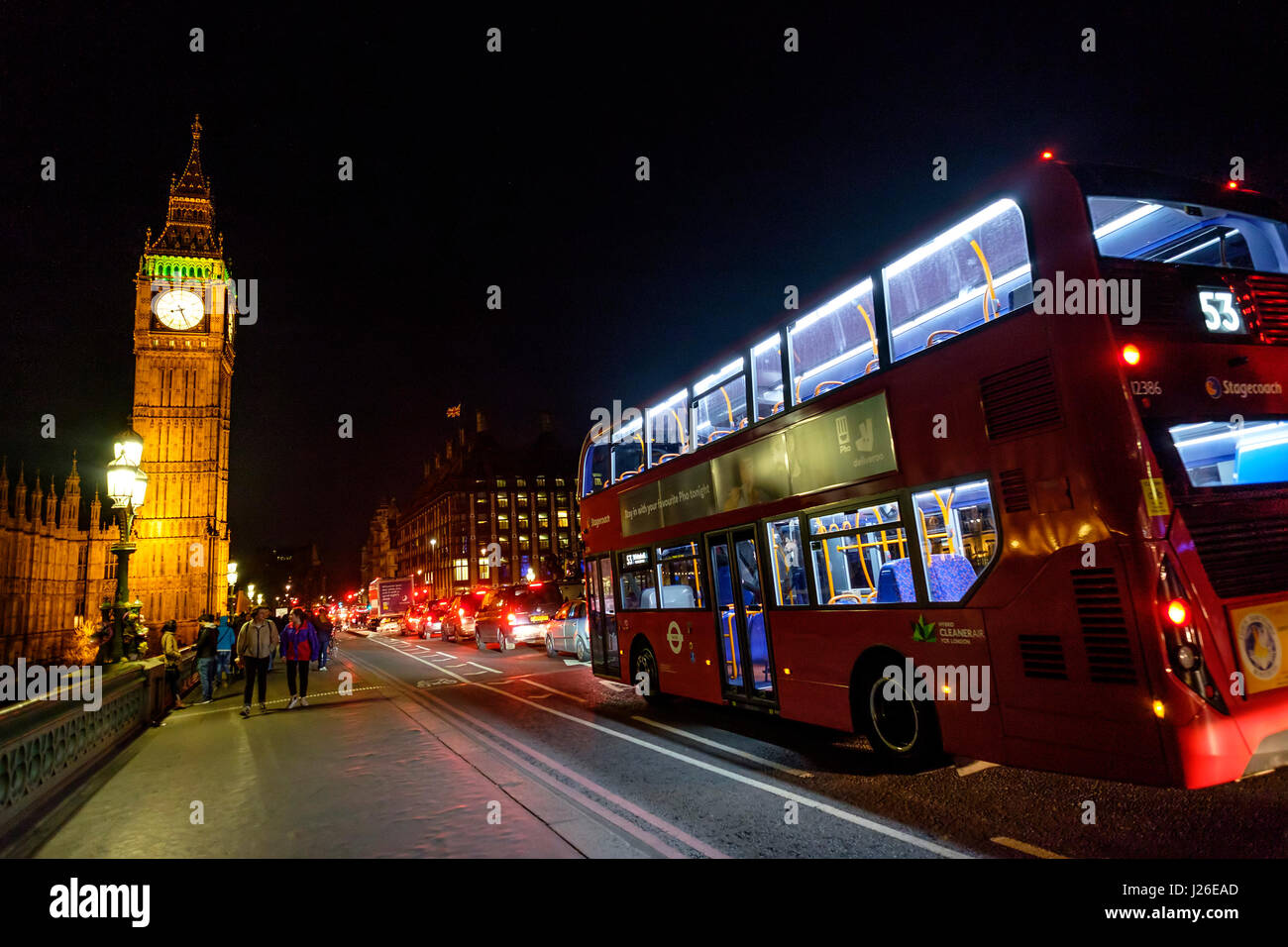 53 Bus passing the Westminster Bridge towards the Big Ben and Houses of Parliament at night time, London, England, UK, Europe Stock Photo