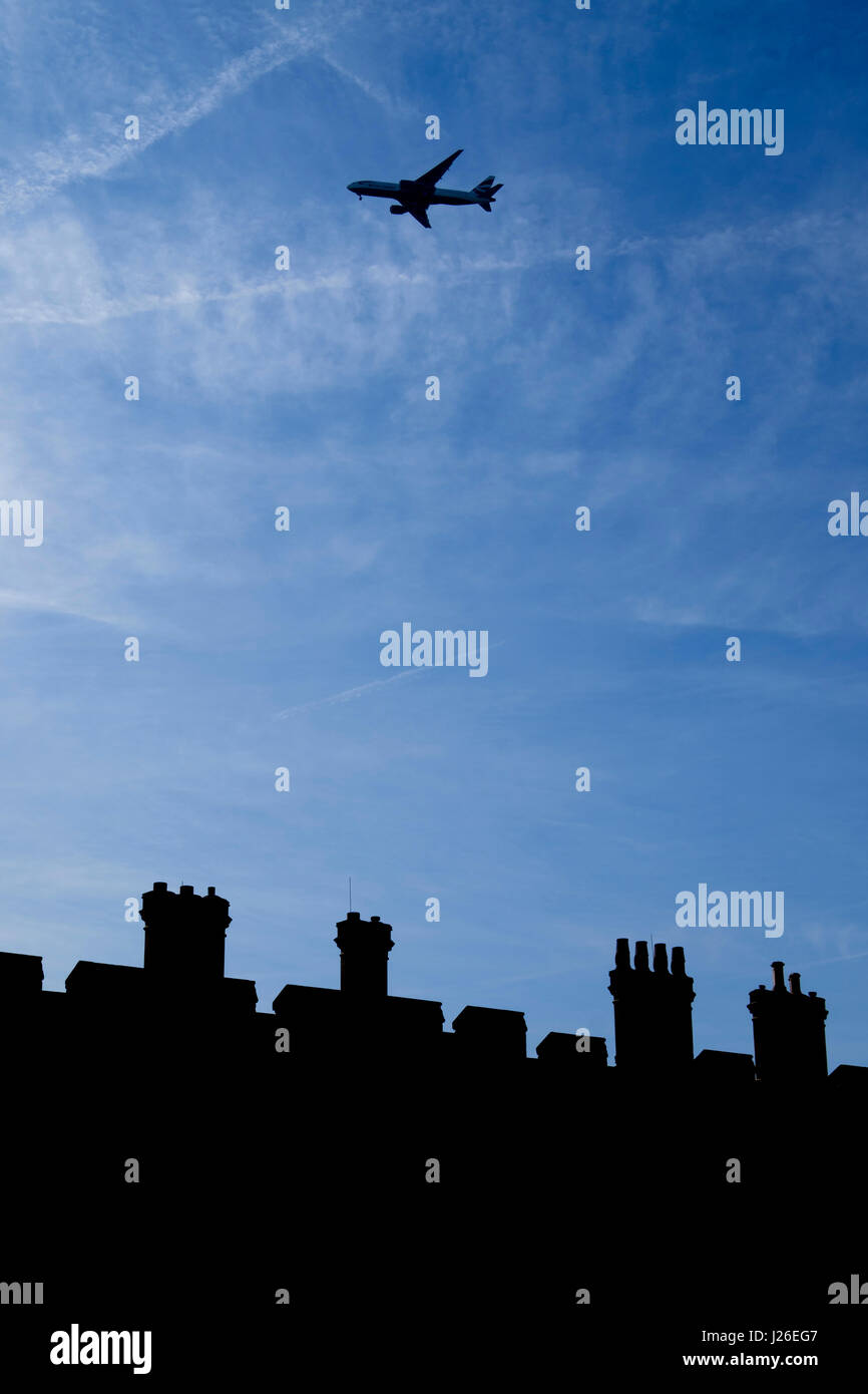 Airplane flying over houses hires stock photography and images Alamy