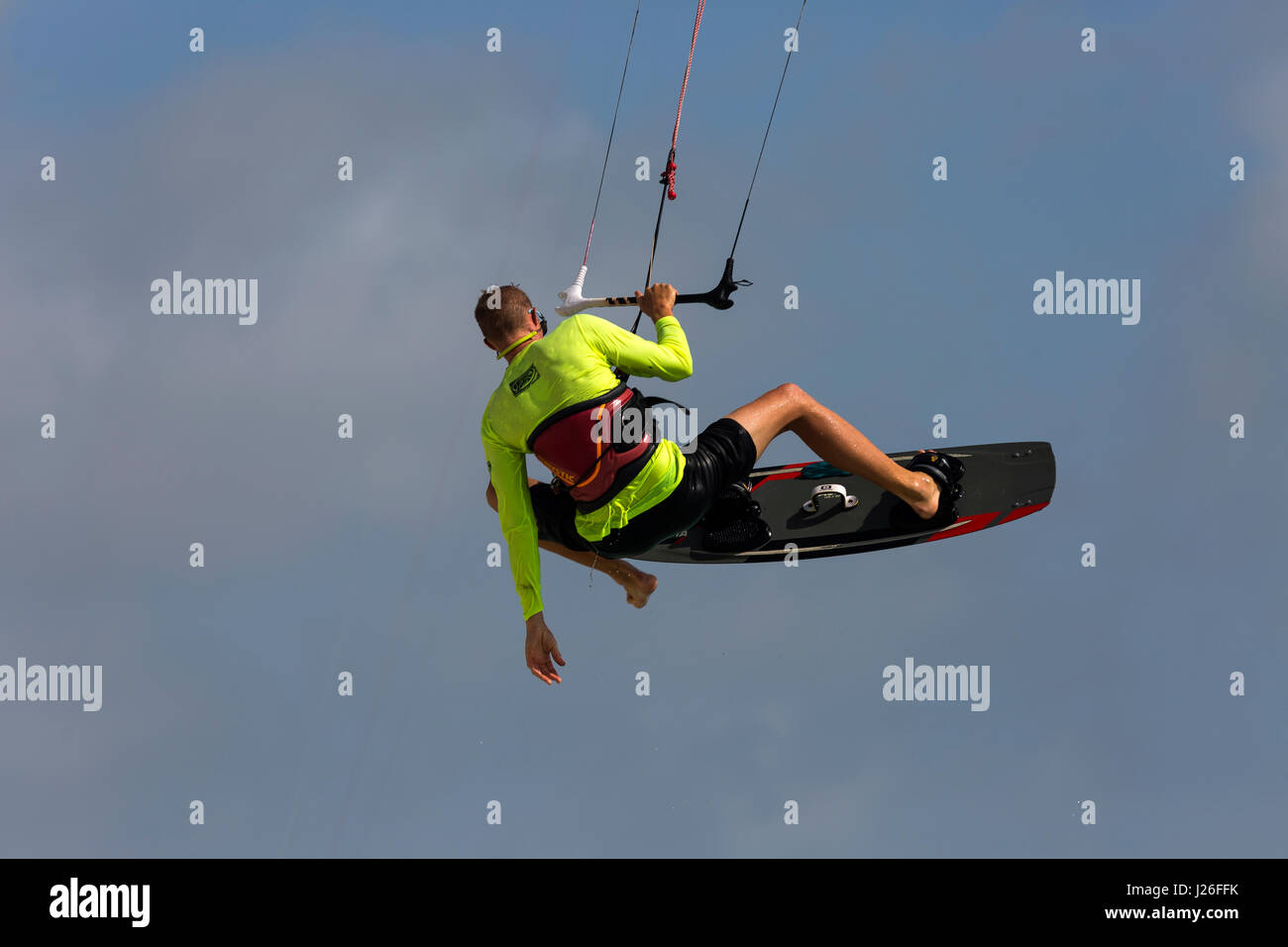 A parasailor catching some air at Hadicurari Beach, Aruba Stock Photo