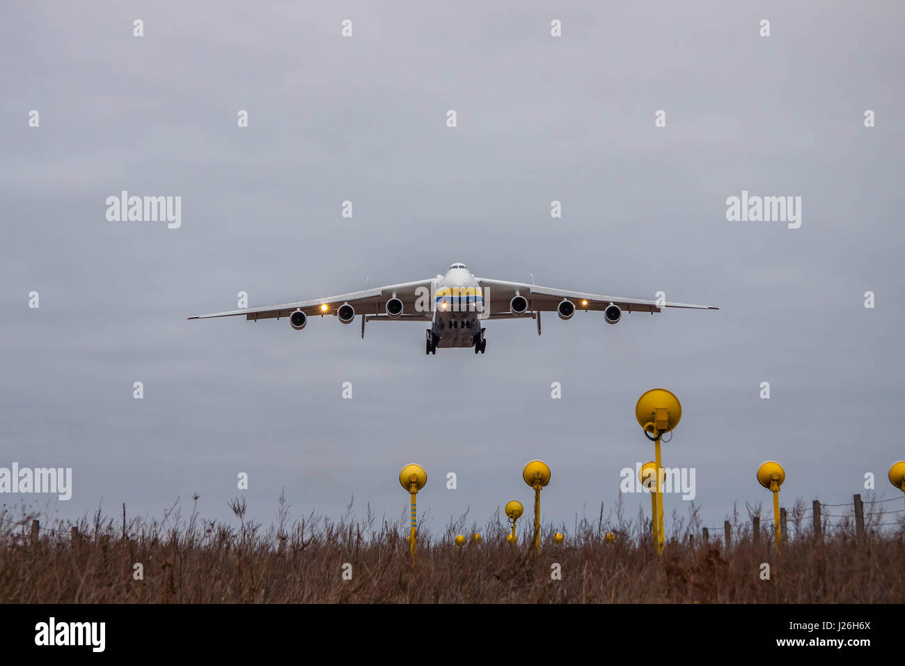 Kiev Region, Ukraine - January 8, 2012: Antonov An-225 Mriya cargo plane is on finallanding at dusk Stock Photo