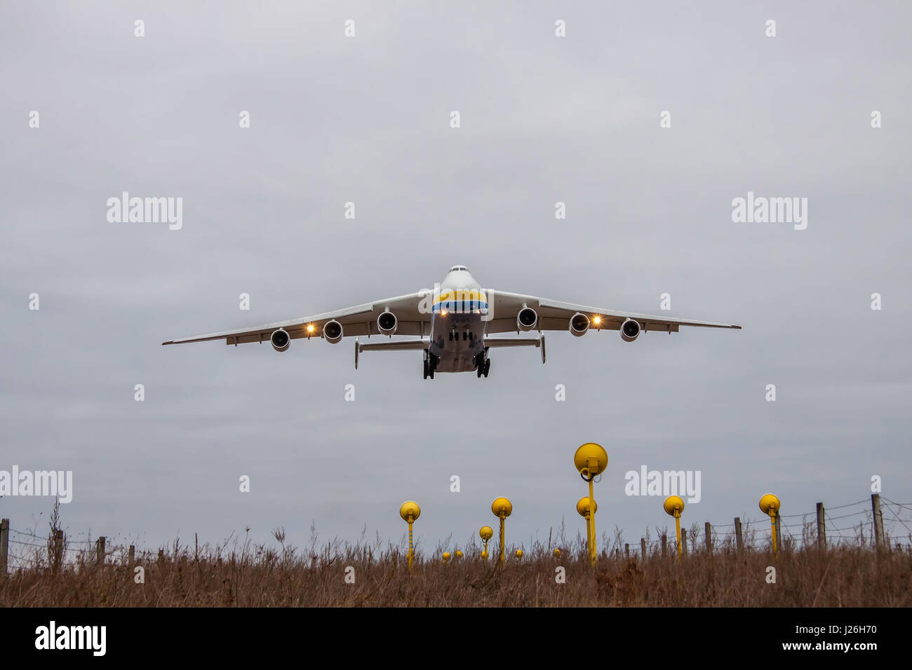 Kiev Region, Ukraine - January 8, 2012: Antonov An-225 Mriya cargo plane is on finallanding at dusk in the airport Stock Photo