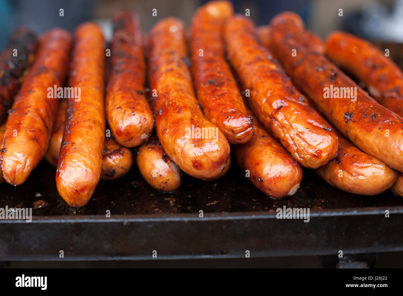 Cooked long hot dog sausages on a grill Stock Photo Alamy
