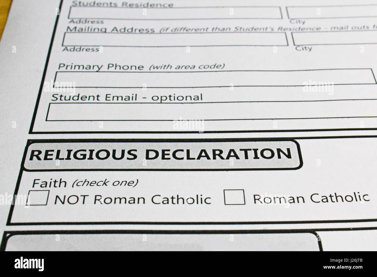 Declaring ones faith in order to attend a catholic school. Stock Photo