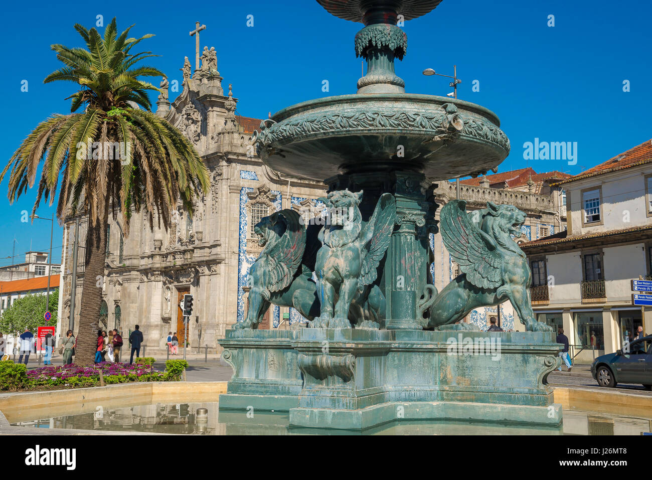 Porto Portugal fountain, the Fountain of Lions sited in the centre of the  Praca de Gomez Teixeira near the azulejos covered Igreja do Carmo church  Stock Photo - Alamy