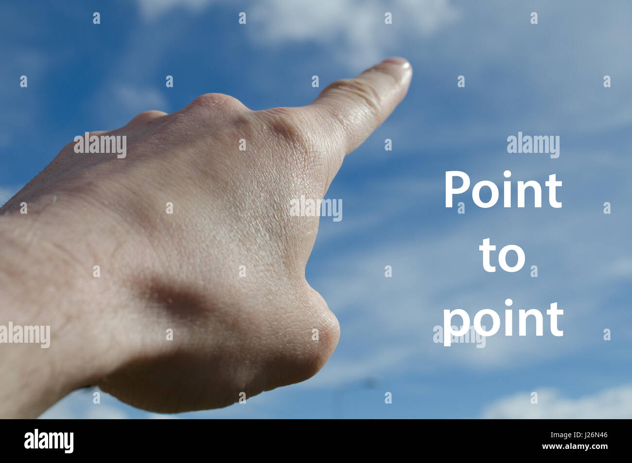 Finger pointing towards blue sky point to point concept Stock Photo