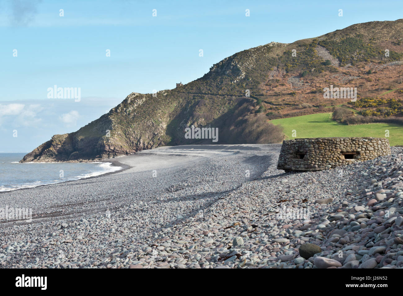 View along the beach in Porlock Bay with Bossington Hill and Hurlstone Point in the distance. Part of the SW Coast path in Exmoor National Park Stock Photo