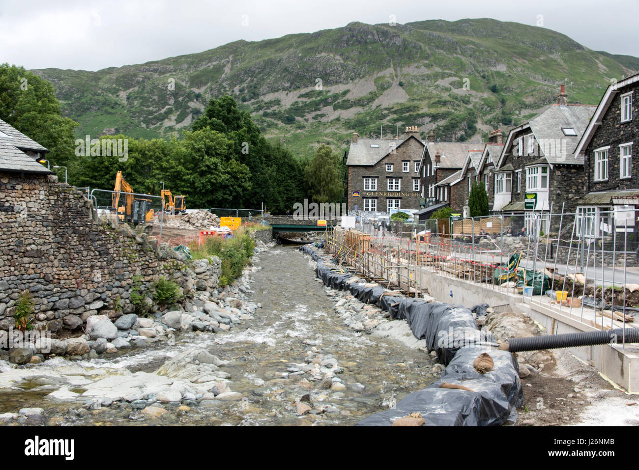 Reconstruction work along the banks of the Glenridding Beck in Glenridding village in the Lake District, Britain. Stock Photo