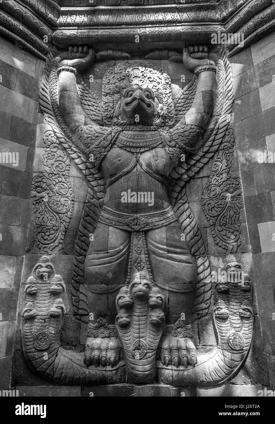 Stone craved Garuda surmounted by four stone faces of Bodhisattva Lokeshvara. Mendut Buddhist Monastery. Mungkid Town, Central Java, Indonesia. Stock Photo