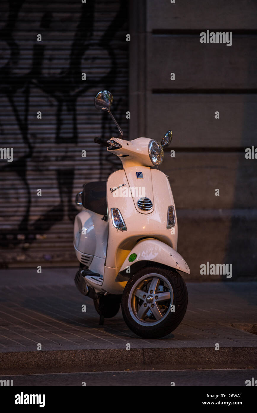 Scooter standing on street in Spain Stock Photo Alamy