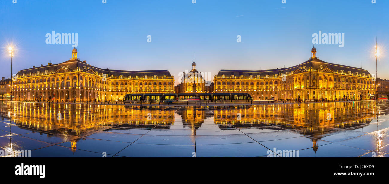 Iconic panorama of Place de la Bourse with tram and water mirror fountain in Bordeaux - France, Gironde Stock Photo