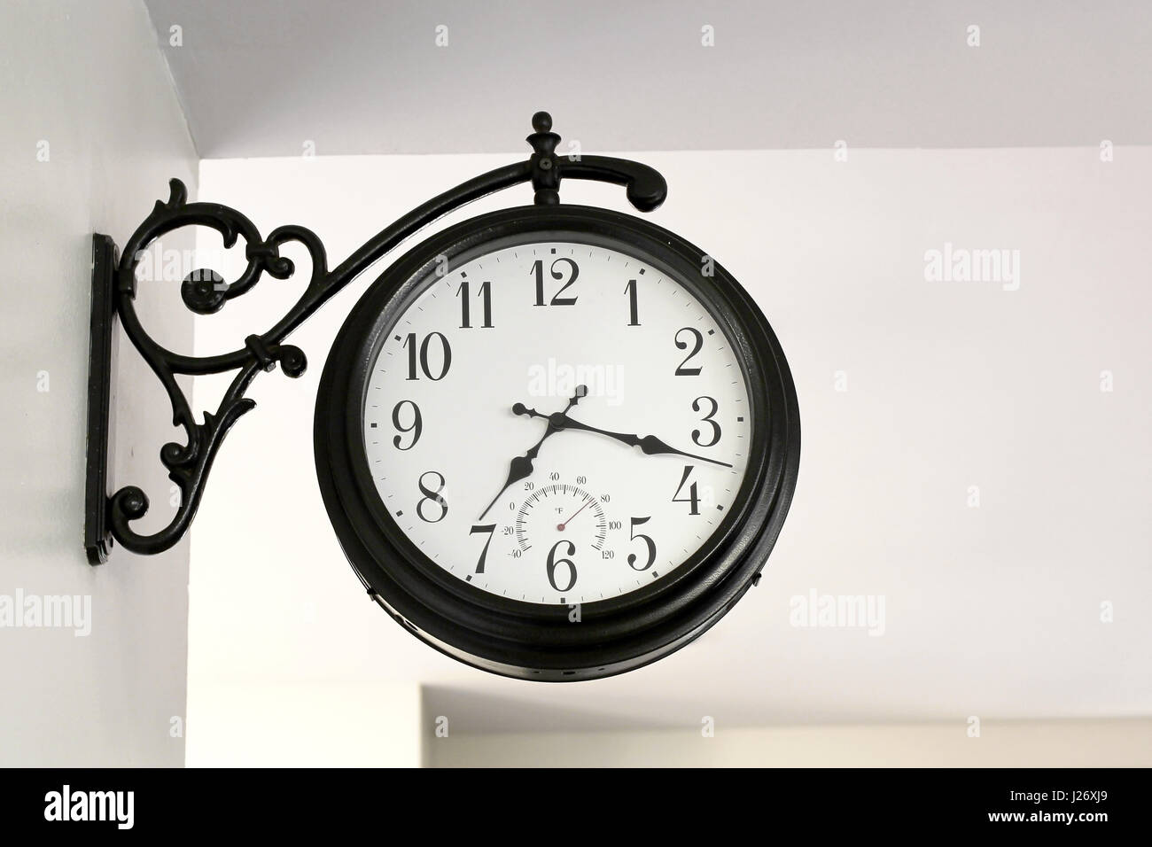 vintage clock hanging on wall Stock Photo Alamy