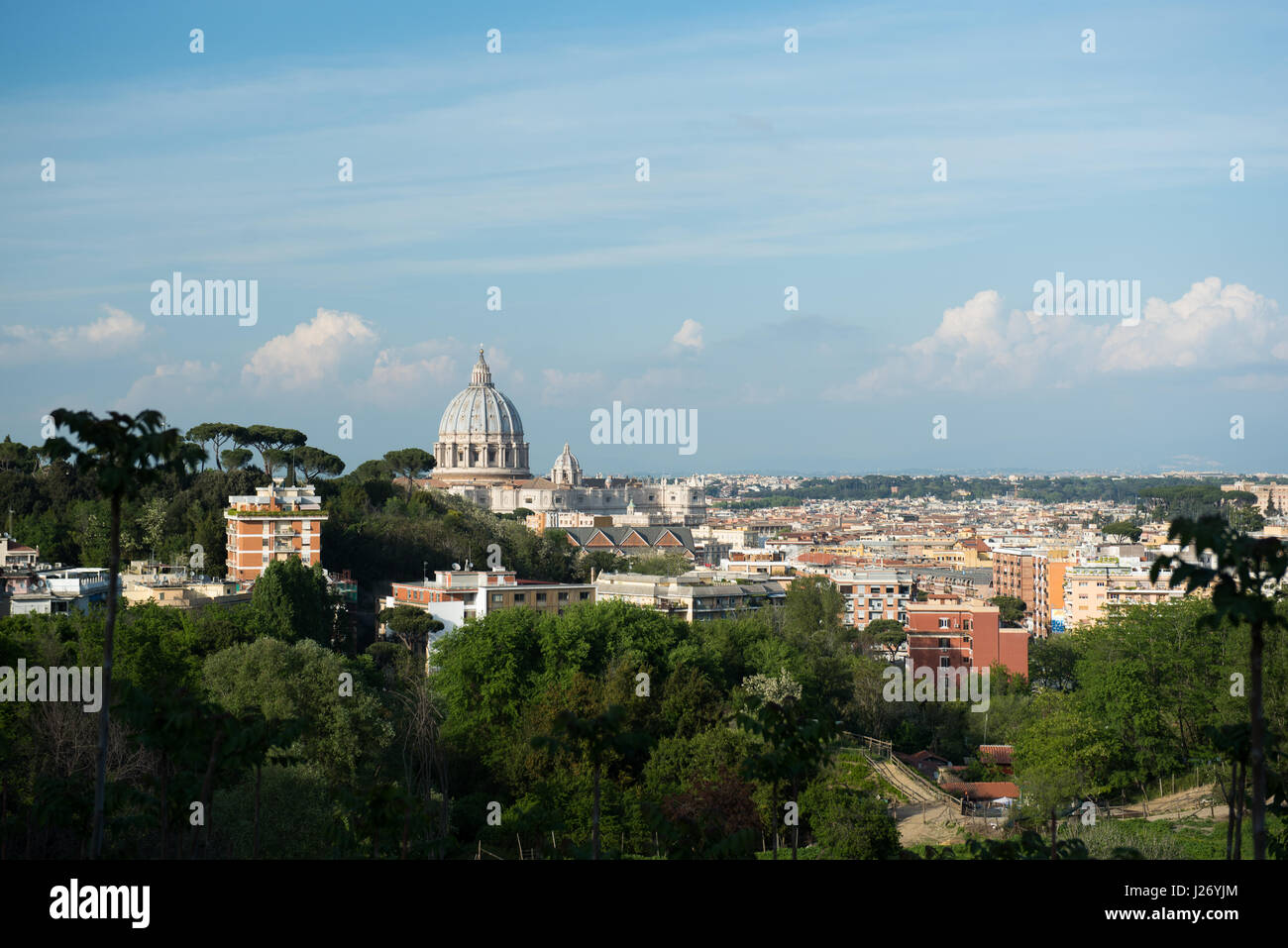 Rome cityscape with St Peter dome, sunset colors and buildings Stock Photo