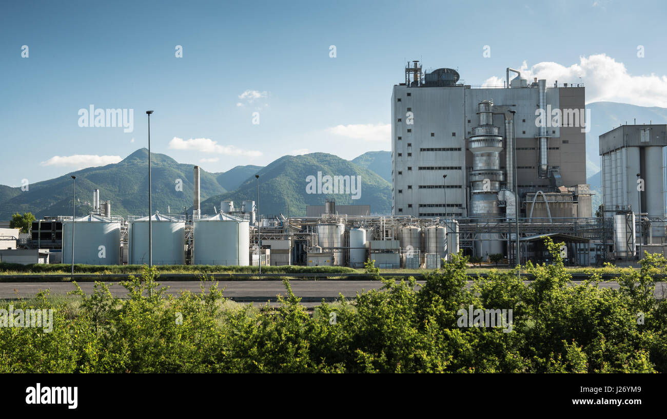 Frosinone, Italy april 23 2017: Industrial building external view in mountainous location, blue cloudy sky Stock Photo