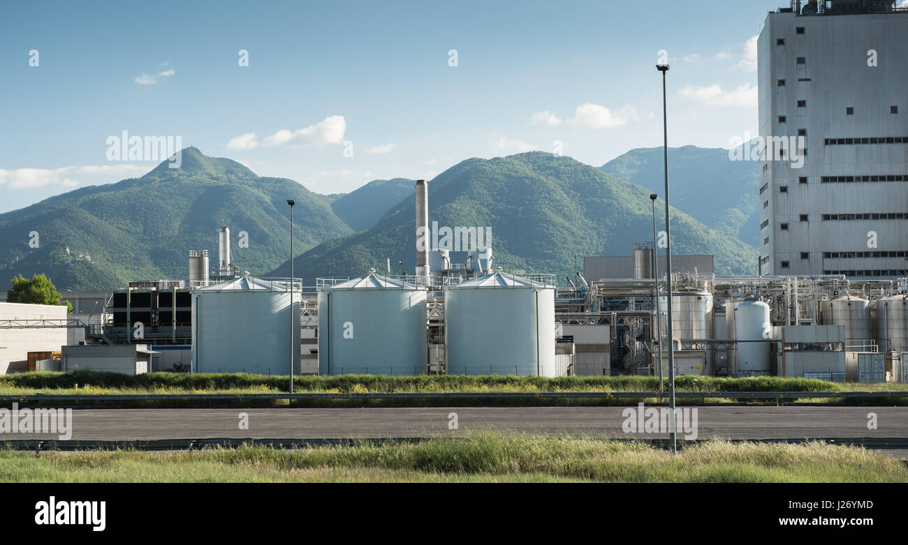 Frosinone, Italy april 23 2017: Industrial building external view in mountainous location, blue cloudy sky Stock Photo