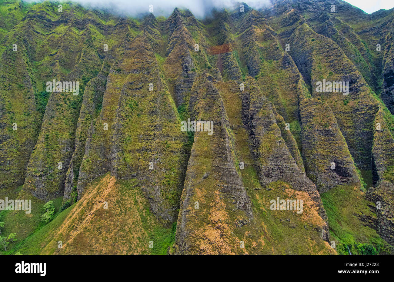 Kauai Hawaii aerial from helicopter of the breath-taking Na Pali coast canyons cliffs Na Pali-Kona Forest Reserve Stock Photo