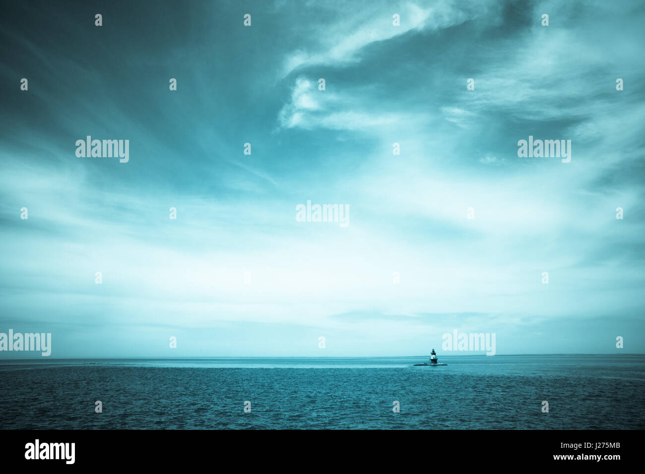 Seascape and dramatic clouds with Orient Point Lighthouse, Long Island