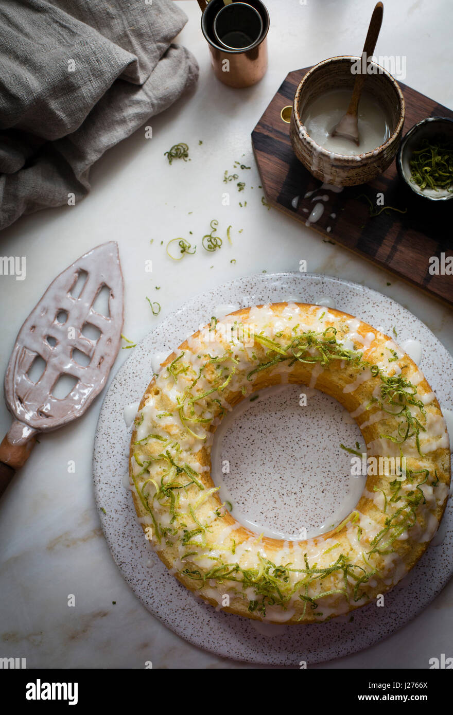 Key lime bundt cake glazed with key lime glaze and topped with lime