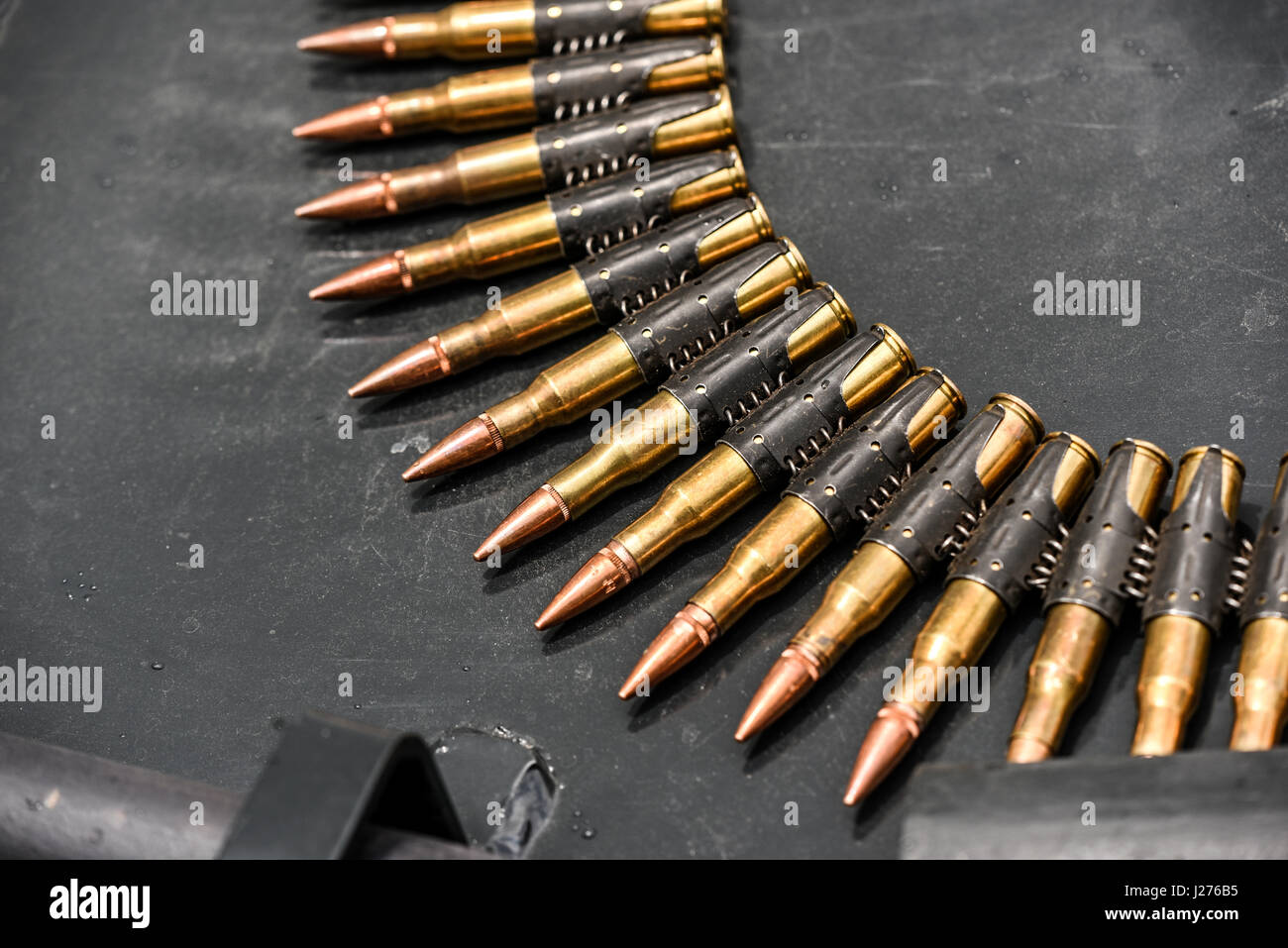 Bullets in ammunition belts outdoor for machine gun Stock Photo - Alamy